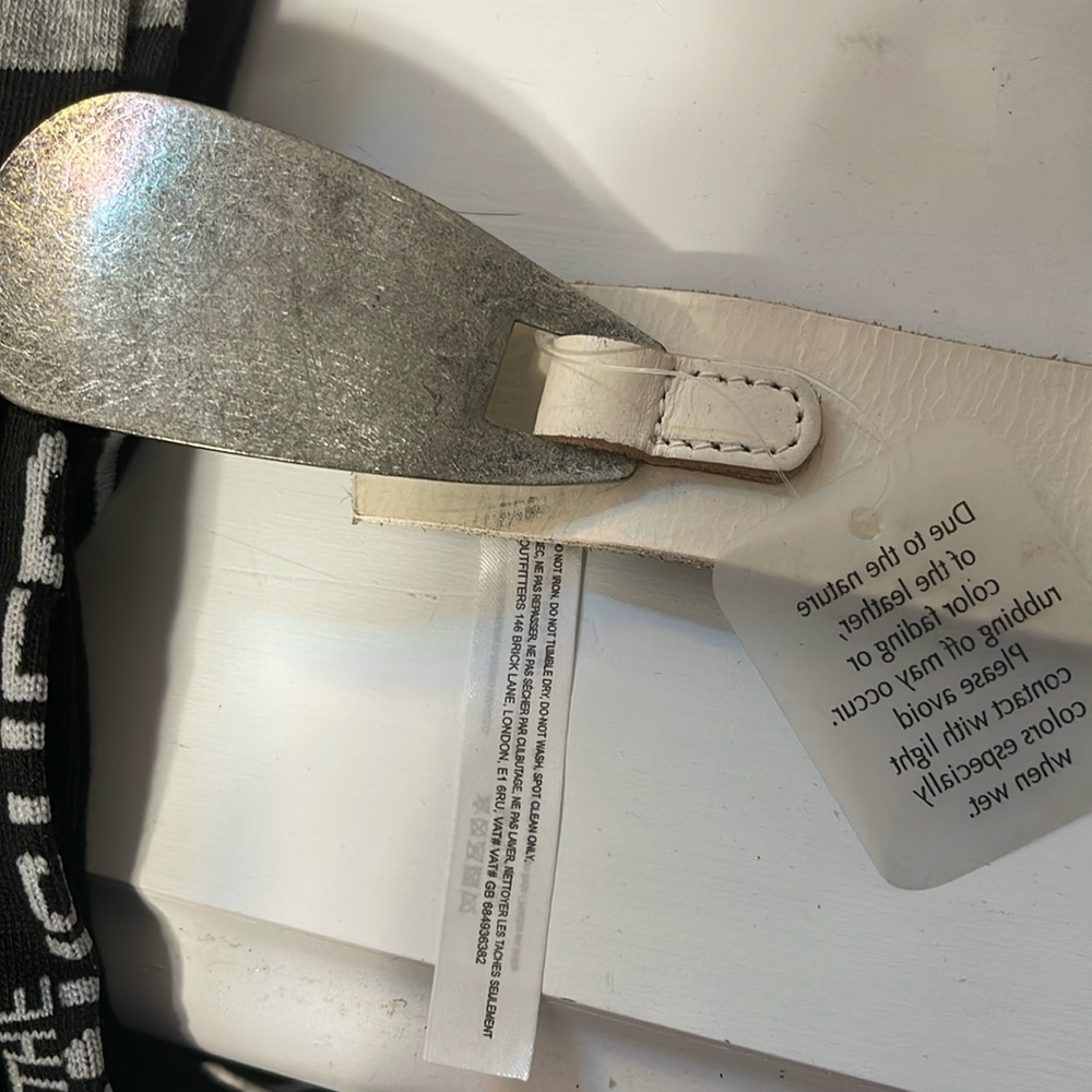 Silver Metal Shoehorn shape with Free People crème Leather Belt